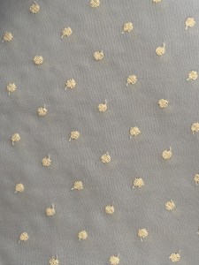 Tela azul con topos beige