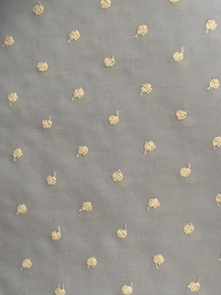 Tela azul con topos beige